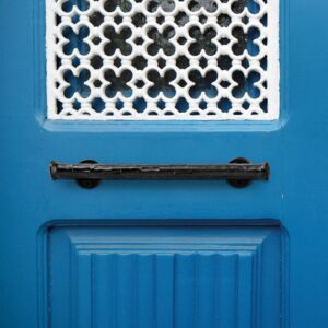 Letterbox on a colourful blue door in Porto old town, Portugal